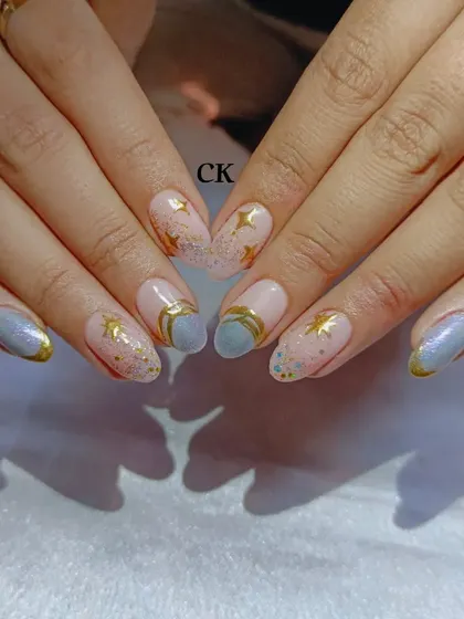 A celestial-themed set with a grey-blue base, gold accents, and hand-painted stars.