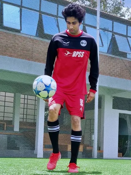 Nakul Jain, now a confident player and coach, showcasing his skills. His transformation is a testament to our training philosophy.