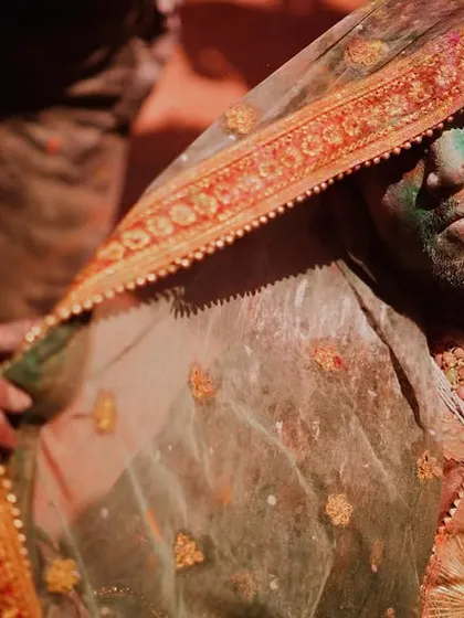 A vibrant collection of images from the Holi celebrations in Braj, specifically Nandgaon. This series captures the pure ecstasy of the festival, with portraits of devotees, men dressed as gopis, and crowds dancing in a cloud of colors.