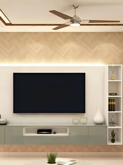This TV unit design uses a herringbone pattern on the accent wall for a subtle touch of classic style. The floating console keeps the floor clear and makes the space feel larger.