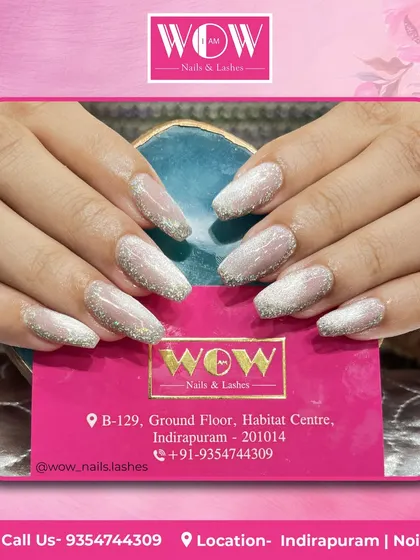 A soft and subtle glitter ombré on square-shaped nails. This is a perfect example of how glitter can be used for an elegant and understated look.