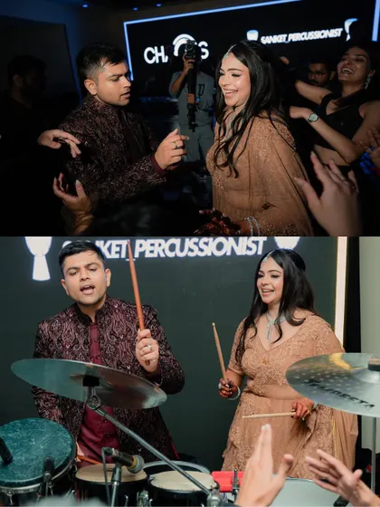 The couple having fun on the drums. We love capturing these unique and interactive moments that make your event special.