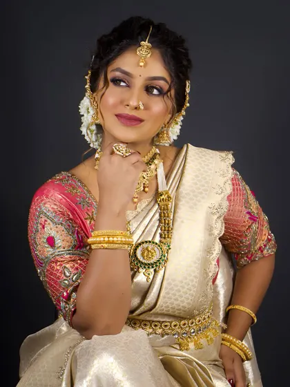 Another angle of the South Indian bridal look, showing the intricate details of the jewellery and the elegant, traditional hairstyle.