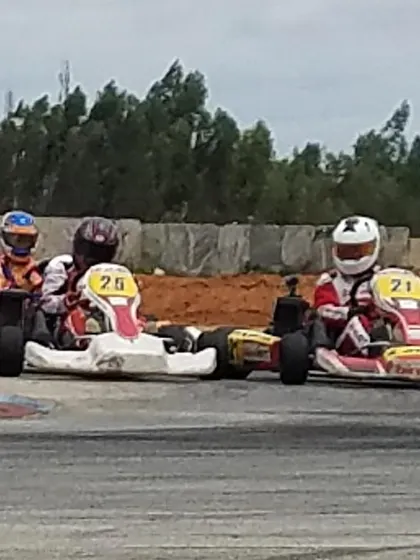 Close racing action between our drivers. This demonstrates the competitive spirit and high skill level within our team.