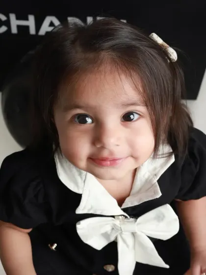 A close-up portrait that captures her sweet smile and beautiful eyes. Sometimes the simplest shots are the most powerful.