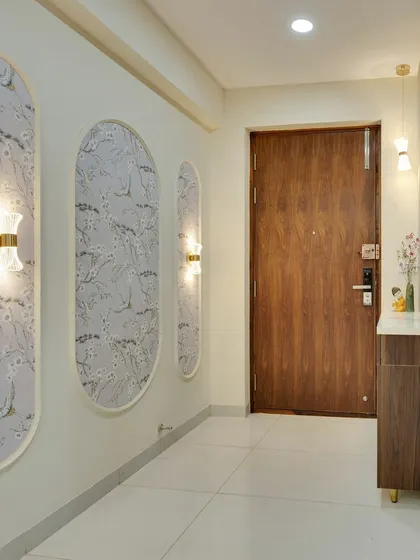 A closer look at the custom-framed wallpaper panels, a detail that adds a layer of sophistication and artistry to the entryway.