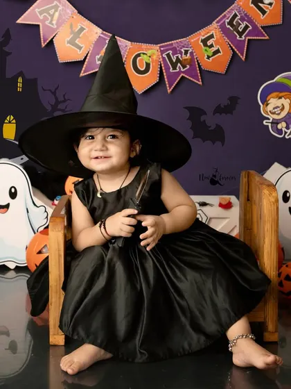 A little witch with a big smile. Our Halloween mini-sessions are all about spooky-cute fun, with adorable costumes and a playful, non-scary set.