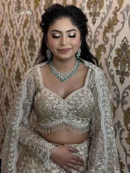 A beautiful shot with her eyes closed, showing the soft shimmer on the lids. This is a versatile party eye makeup look that is glamorous yet elegant.