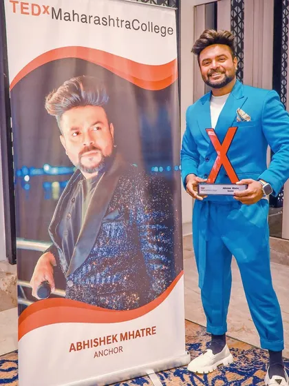 Posing next to my official banner at the TEDx event.