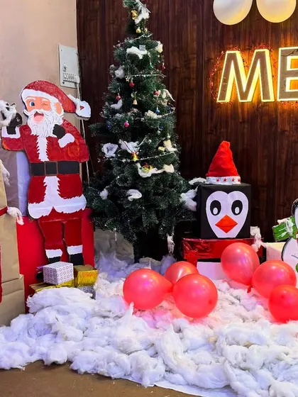 A photo of our Christmas decorations, complete with a tree, Santa, and a snowman. It's all about creating a joyful and festive vibe for our students.
