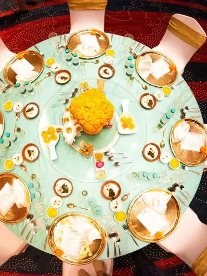 A duplicate of the top-down table setting, emphasizing the vibrant colors and detailed arrangement.