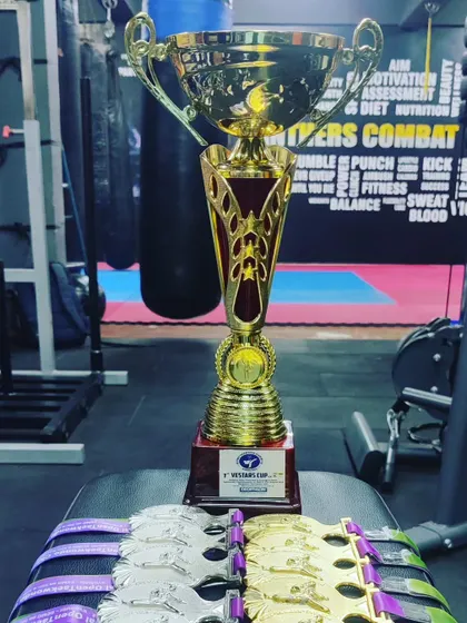 Our winners' trophy and medals from the 1st Vestars Cup G4 Open National Taekwondo Championship. The team secured 11 Gold, 10 Silver, and 7 Bronze medals.