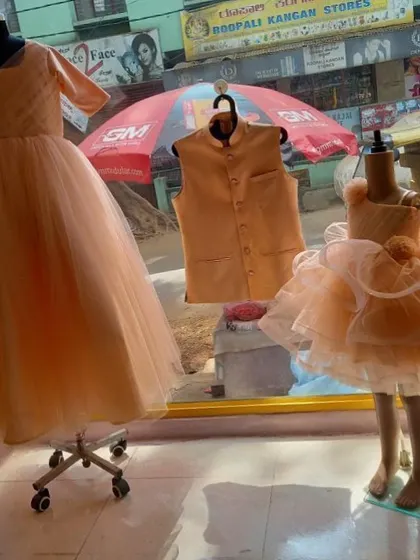 This is a peach-colored combo I designed for a family. It includes a simple gown for the mom and a very frilly, layered frock for her daughter.