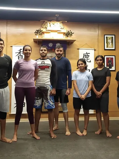 A group photo after a wrestling fundamentals class at The Dojo. A strong wrestling base is a huge advantage in MMA.