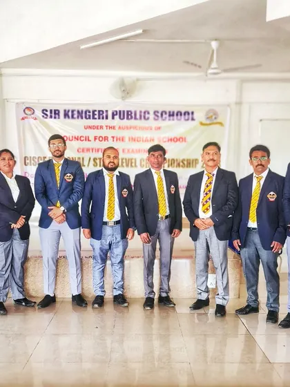 Standing with fellow officials at the CISCE Regional/State Championship. Teamwork is essential not just for competitors, but for those who run the events as well.