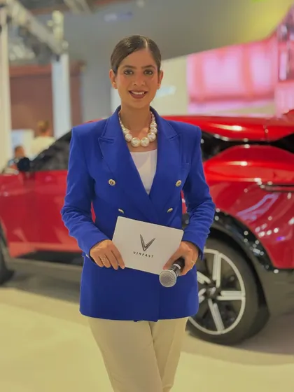 Ready to go live from the VinFast pavilion. Holding the mic and the brand brief, I am prepared to represent VinFast and their vision for sustainable mobility in India.