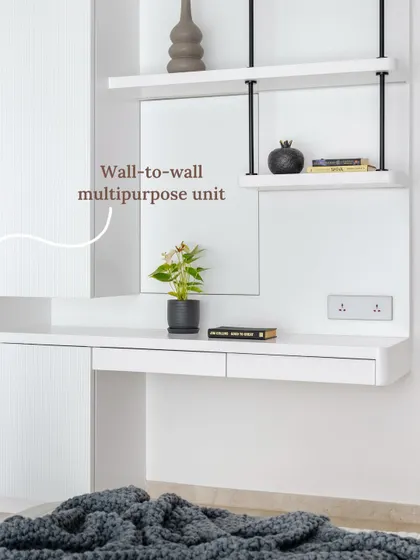 A collection of five compact workspace designs, including an all-white setup that merges a floating desk with shelving and cabinetry for a clean, complete workstation.