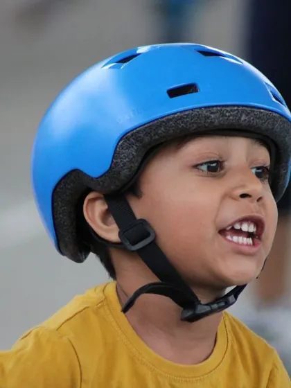 A close-up of a young skater, full of excitement and energy. We capture these moments to celebrate the spirit and enthusiasm of our little champions in training.
