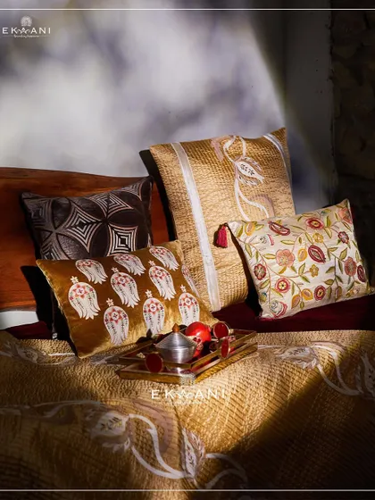 Inspired by the richness of pomegranates, my Anardana collection blends elegance with artistry. This arrangement of cushions in warm, earthy tones and intricate patterns elevates any space with sophistication.