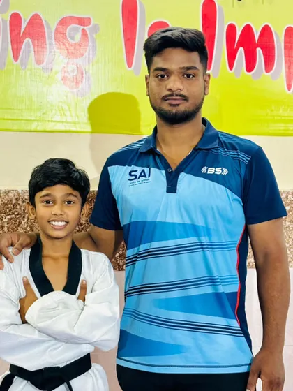 With one of my promising young students. The bond between a coach and an athlete is built on trust and shared goals.