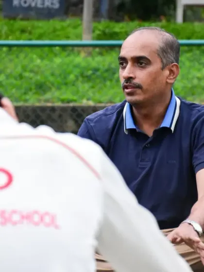 A close-up of our co-founder mentoring a player, showing the personal investment we have in each student's journey.