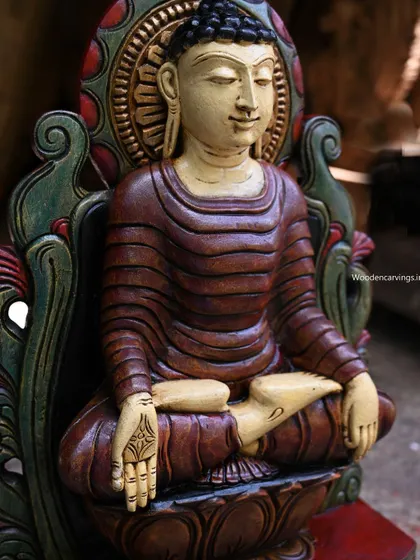 A side view of the 24-inch ancient-look Buddha, highlighting the carved details of the throne.