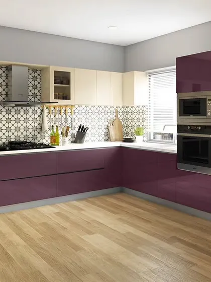A bold and vibrant kitchen with glossy purple and cream cabinets. This design shows how color can be used to create a personalized and energetic cooking space, complete with a built-in oven.