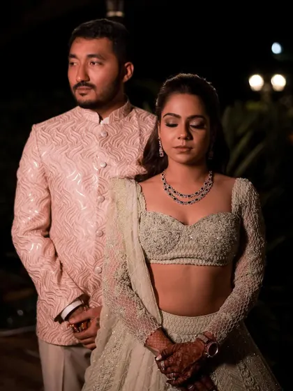 An elegant couple shot showcasing a timeless Sangeet look that is both modern and classic.