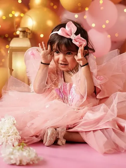 So much personality! We love capturing the playful and cheeky expressions that make your toddler unique during their birthday photoshoot.