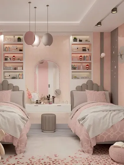 I designed this shared bedroom for two sisters, using a soft pink and grey palette. The symmetrical layout with a shared central vanity creates a sense of harmony, while individual beds provide personal space.