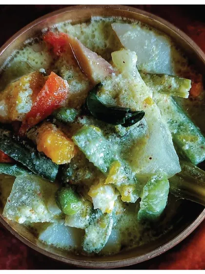 Avial from Palakkad, a harmonious blend of vegetables, coconut, and yogurt. The recipe's only real effort is the meticulous chopping of vegetables into equal sizes, a skill perfected by a math teacher grandfather.