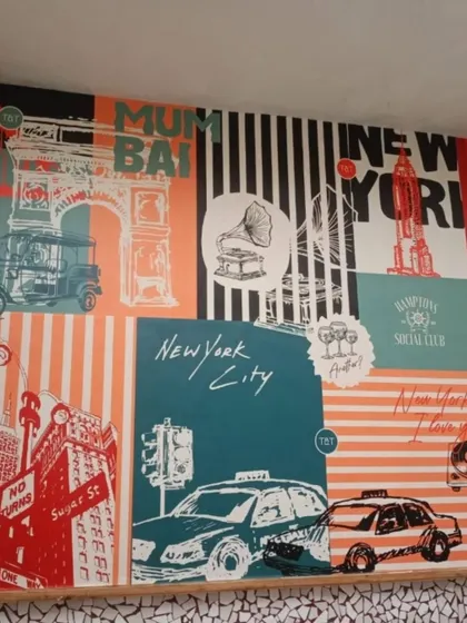 This fun, graphic-style wallpaper collage celebrates iconic imagery from Mumbai and New York City. It's a perfect fit for a themed cafe or restaurant, creating a vibrant and eclectic energy that sparks conversation.