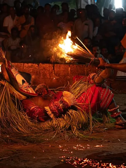 A series capturing the different stages of the Pottan Theyyam ritual, from the performer lying on the embers to being tended to by assistants. These images show the intensity and devotion involved in the all-night ceremony.
