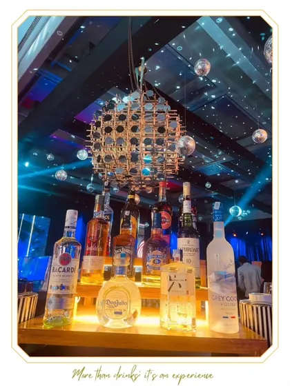 A dynamic bar setup for a party, featuring a large disco ball centerpiece and multiple smaller mirror balls. This design is all about creating a high-energy, celebratory dance floor vibe.