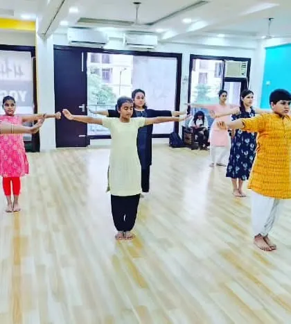 Our adult beginners' batch practicing their arm movements and postures, proving that it's never too late to start learning dance.