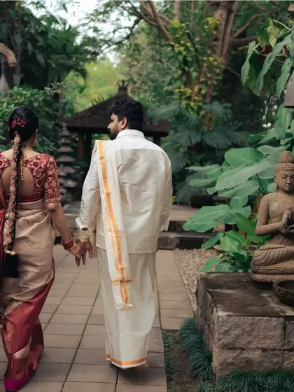Walking away together, hand in hand. This classic post-wedding shot symbolizes the beginning of their shared path in life.