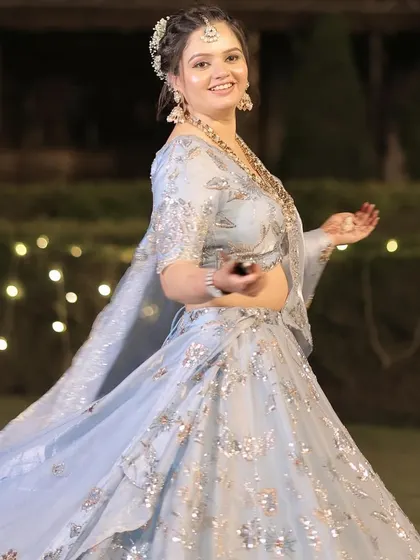 Another joyful twirling shot, the movement of her lehenga creating a beautiful effect.