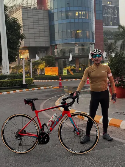 A rider and his red Giant TCR bike, ready for action.