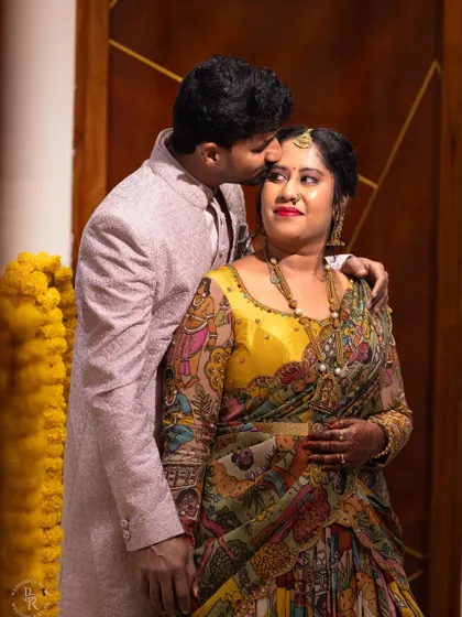 Another beautiful, intimate moment from the housewarming celebration. His gentle kiss on her forehead is a perfect expression of love and new beginnings in their new home.