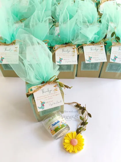 The full set of 20 personalized birthday return gift boxes for a dinosaur party in Mumbai. The consistent packaging ensures a professional and cohesive look for all the party favors.