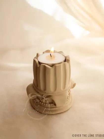 This Corinthian pillar is designed as a tealight holder. Made for a custom order in a soft eggshell color, it combines classical architecture with practical use.
