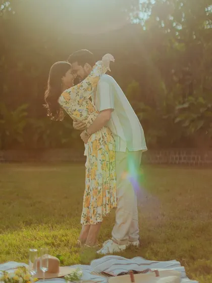 A sun-drenched afternoon, a romantic picnic, and a love that glows. We love capturing these soft, golden-hour moments that feel warm and intimate, letting the natural light paint a beautiful story.