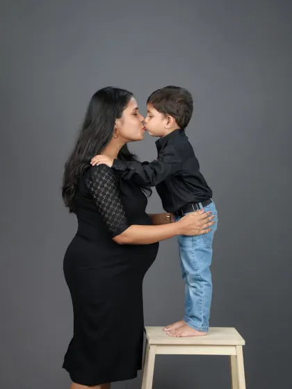 A beautiful moment of love as a big brother-to-be gives his mom a sweet kiss. Family maternity sessions are a wonderful way to capture the love that’s already there as you wait for the new arrival.