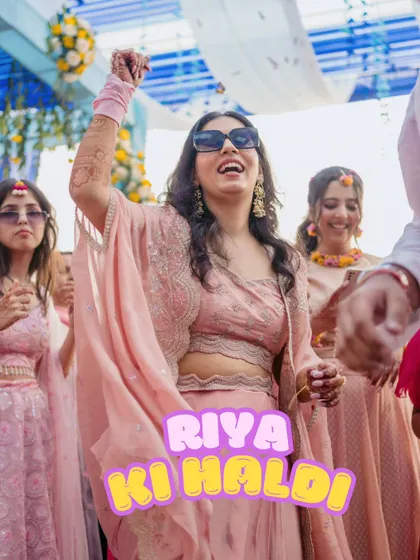 A high-energy candid shot of a guest dancing with abandon at the haldi ceremony. This photo perfectly captures the fun and celebratory vibe of the event.