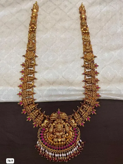 A single long haram from my 92.5 silver collection, featuring a detailed Lakshmi pendant surrounded by vibrant pink stones. This is a true statement piece.