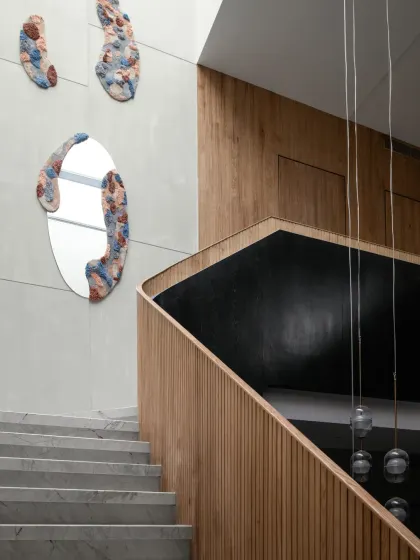 Every aspect of The House of Dancing Screens has been meticulously curated. These custom-designed mirrors with organic, textured frames are both functional objects and unique pieces of wall art.