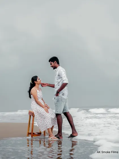 A gentle moment captured during a pre-wedding shoot on a beach in Pondicherry, with the waves at their feet.