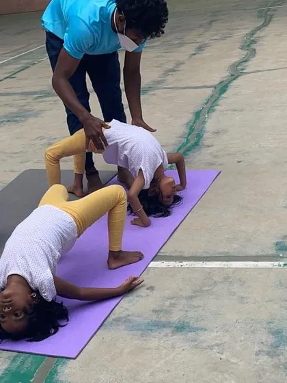 A look at our outdoor program, where we bring "Serious Fun" right to your apartment's doorstep. These images show kids enjoying gymnastics and yoga on mats in both indoor and outdoor community spaces.
