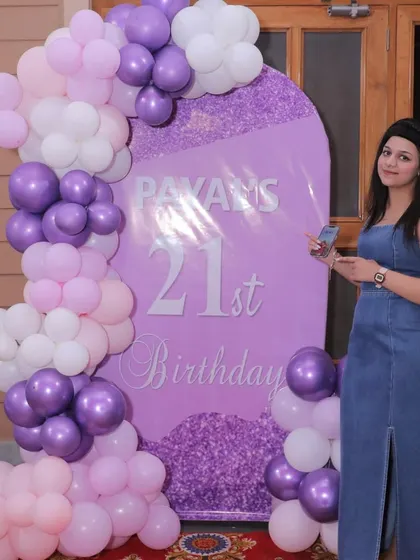 Payal posing in front of her personalized 21st birthday backdrop. We love seeing our clients enjoy their special day!