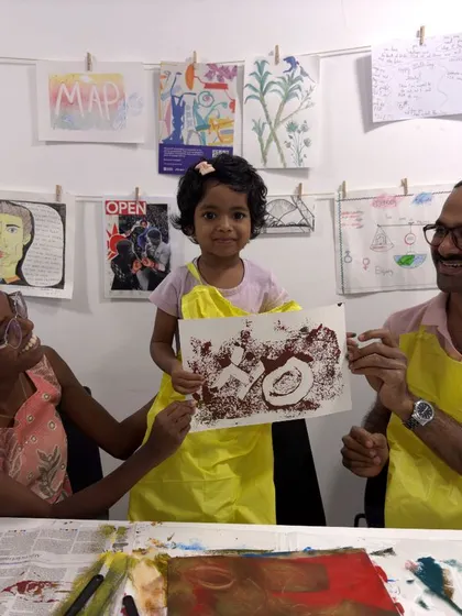 The finished product! This family proudly displays their collaborative artwork, a beautiful memento from our workshop.